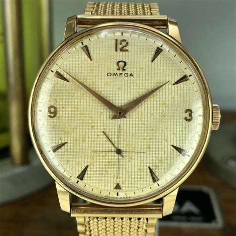 vintage omega solid gold watch.